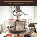 Cute ways to decorate for Halloween using a tiered tray, Rae Dunn mugs, pumpkins, bats