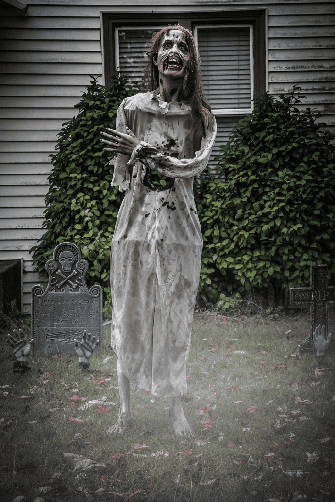 Scary ways to decorate your house for Halloween with outdoor zombie woman figurines