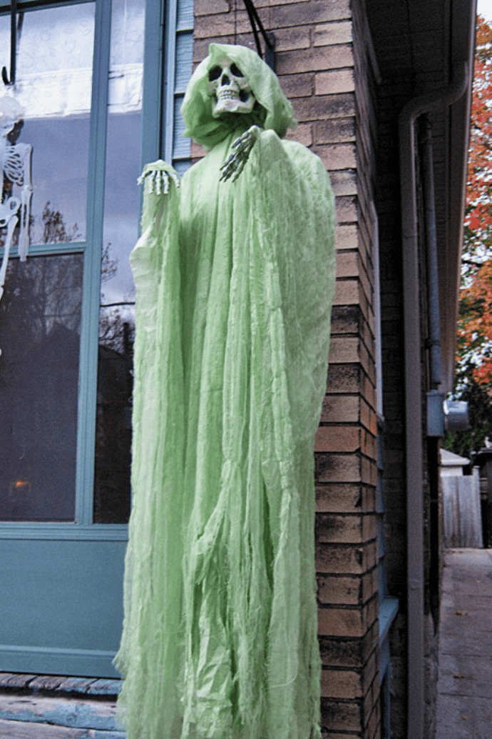 Scary ways to decorate your house for Halloween with outdoor ghost figurines