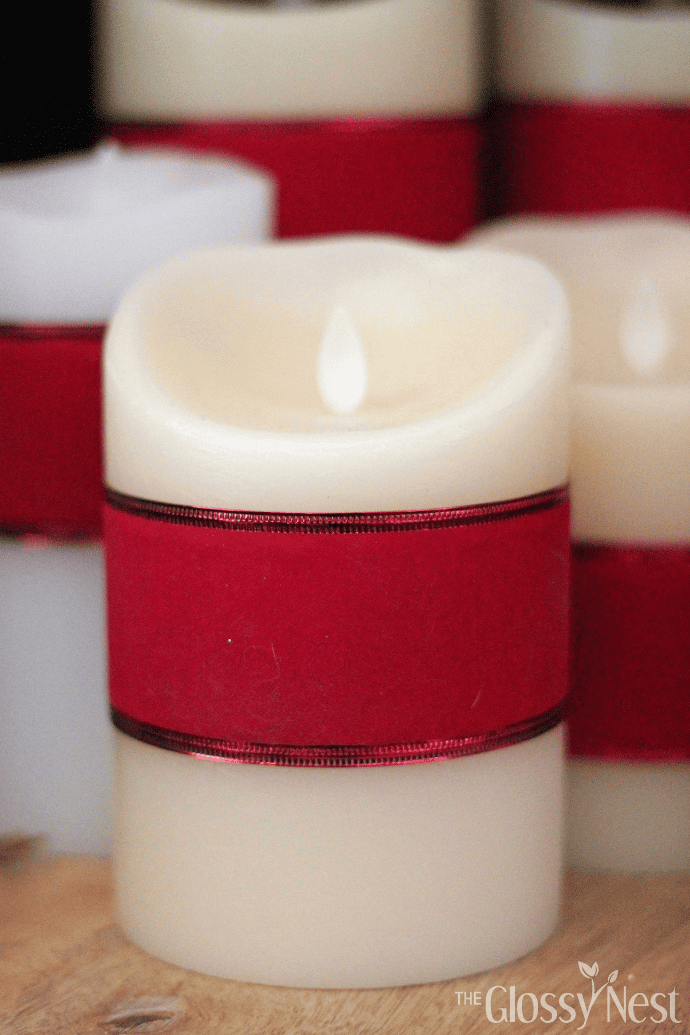 How to decorate a candle with red ribbon