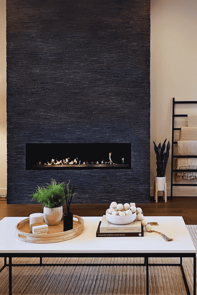 electric fireplace with black chimney breast wall in modern living room