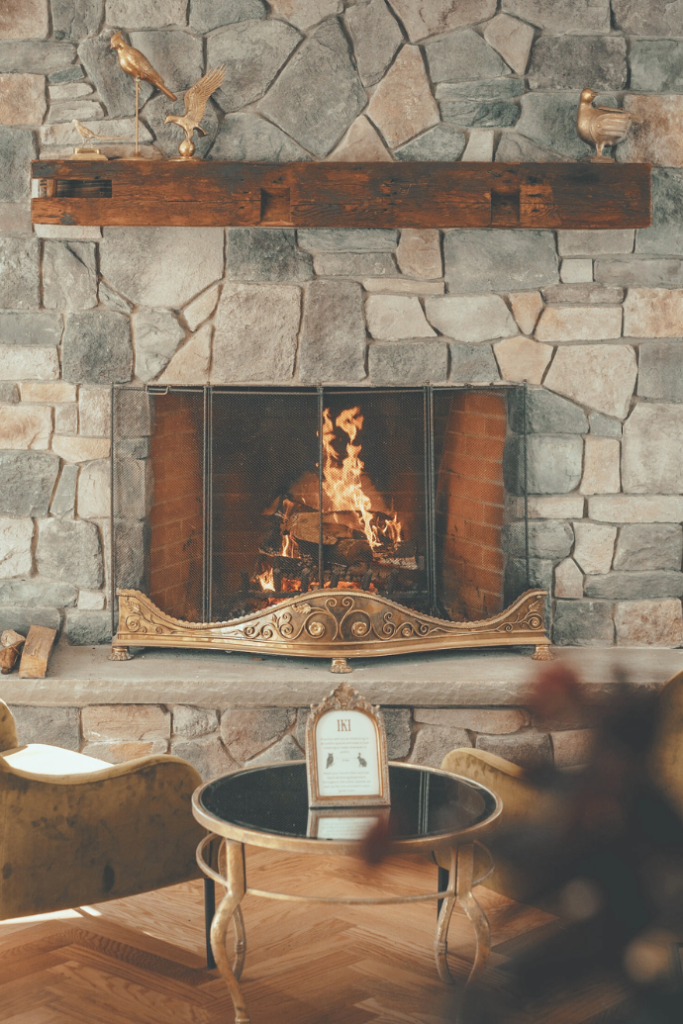 living room stone fireplace with mantel, hearth