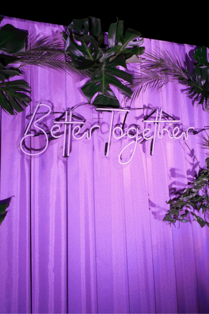 better together wedding neon sign with curtain backdrop