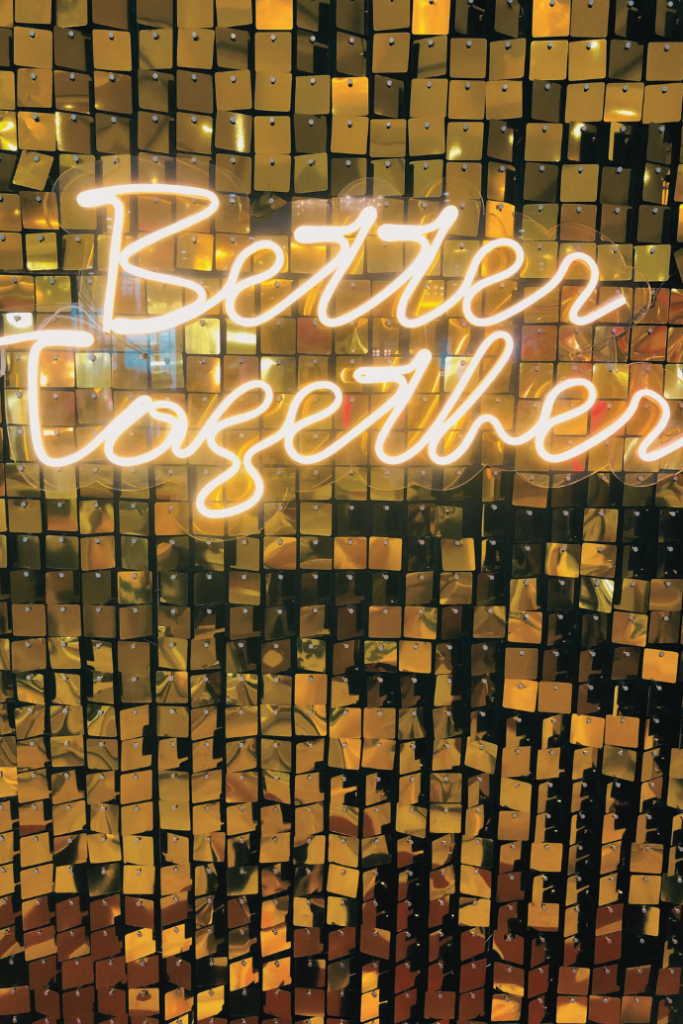 better together wedding neon sign with shimmer panel backdrop