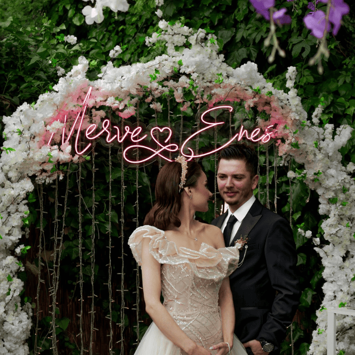 name wedding neon sign with arch, string light backdrop