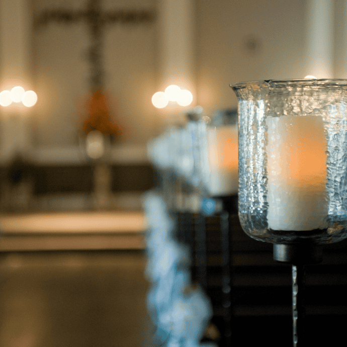 flameless candles in hurricanes for wedding aisle