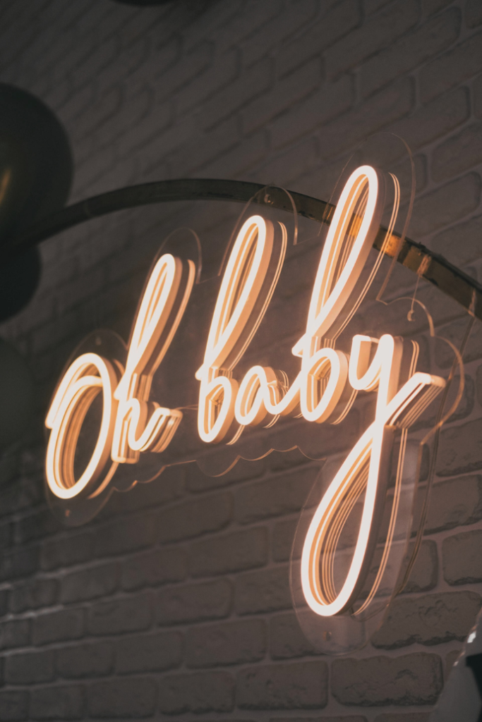 oh baby wedding neon sign on metal arch