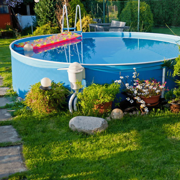 above ground pool with flowers, plants