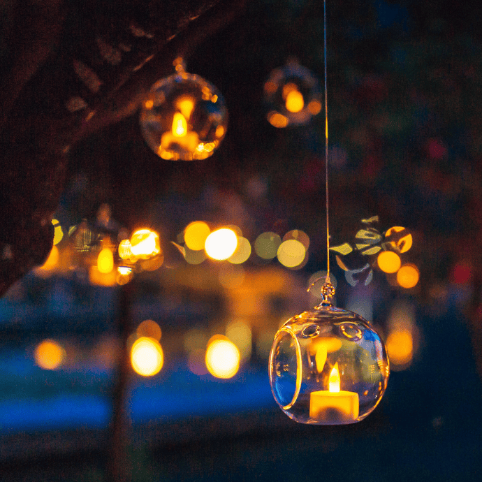 hanging glass led tea light holders at wedding reception