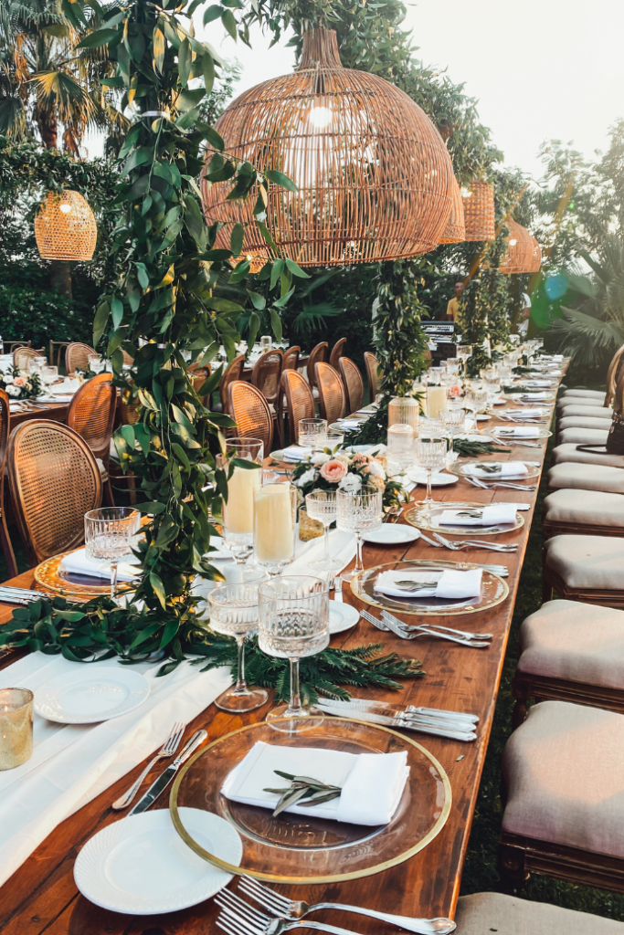 wedding reception tablescape with flameless candles, greenery, boho decorations