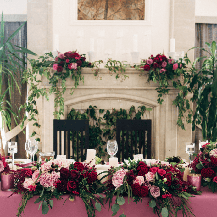 candles, flowers for wedding sweetheart table, fireplace mantel at wedding reception