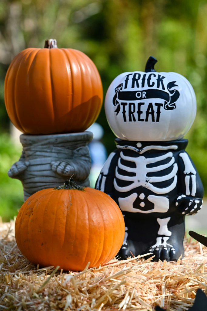 cute halloween pumpkins, candle holders, hay bale