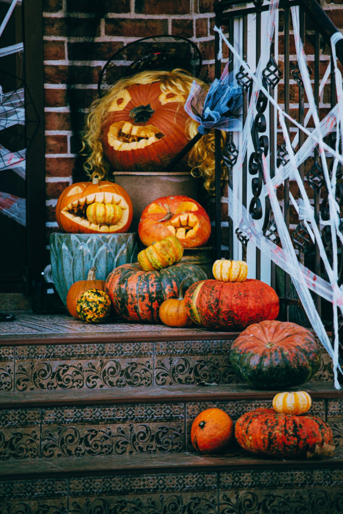 halloween front porch with jack-o-lanterns, pumpkins, gourds