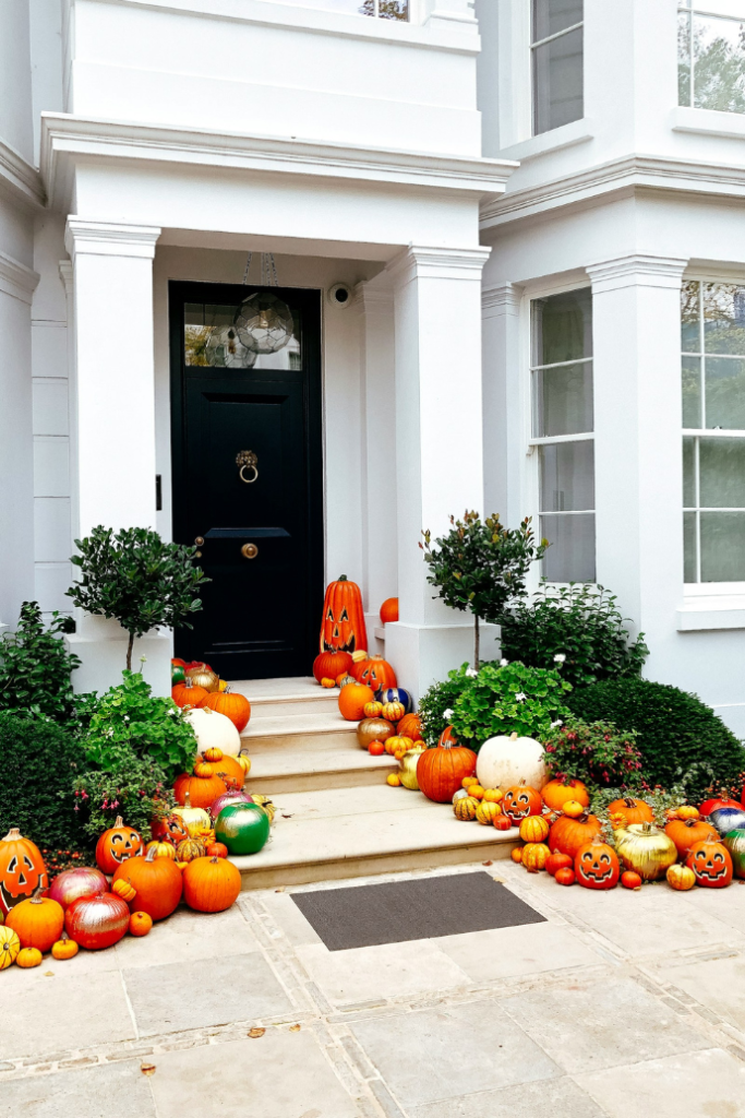 halloween front porch with lots of pumpkins, jack-o-lanterns