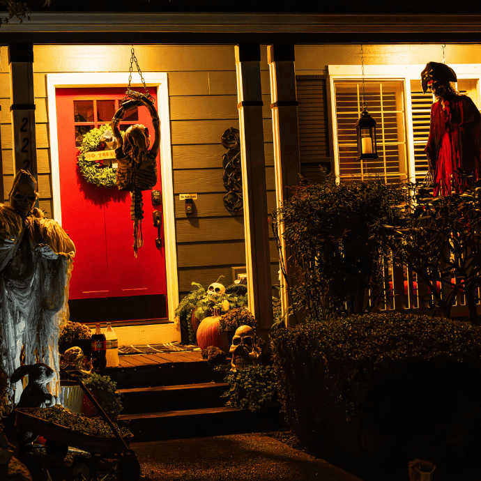 halloween front porch with spooky monsters, skulls, wreath, hanging decorations