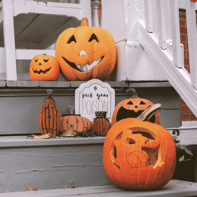 halloween front steps with jack-o-lanterns, signs