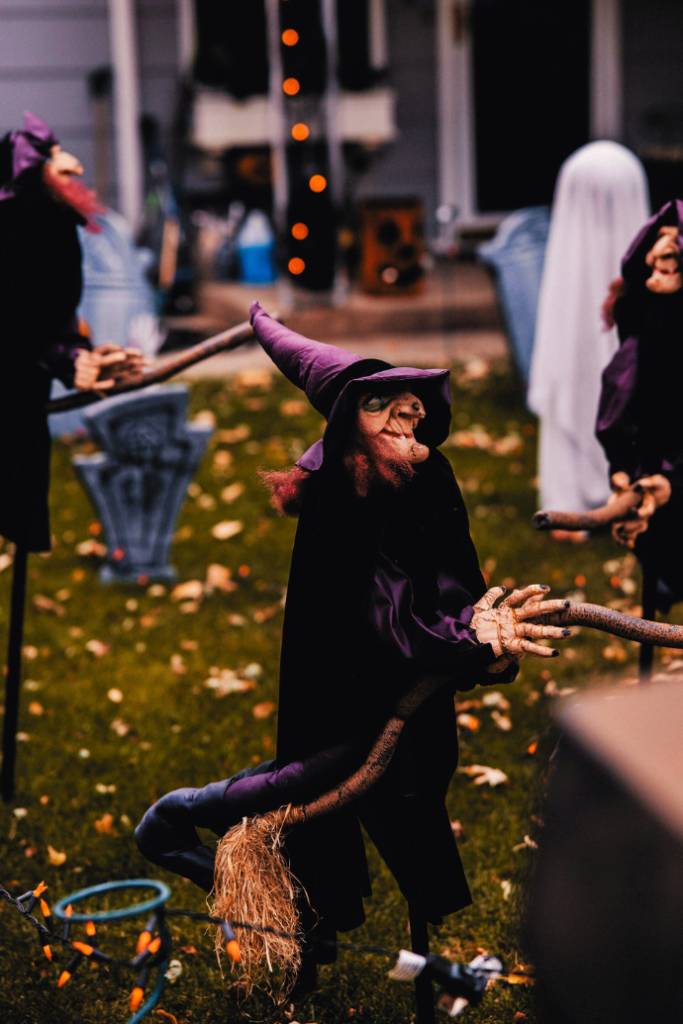 witch figurine in halloween front yard display