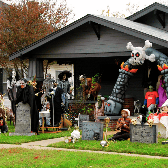 monsters, blow up arch, tombstones in halloween front yard display