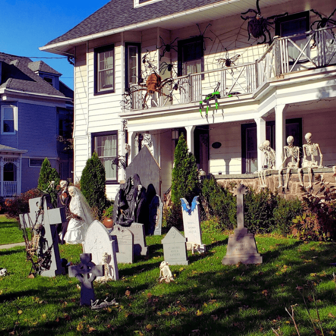 graveyard, skeletons, spiders in halloween front yard display