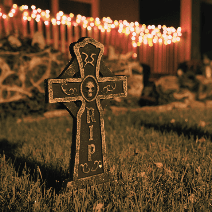 fake tombstone, lights in halloween front yard display