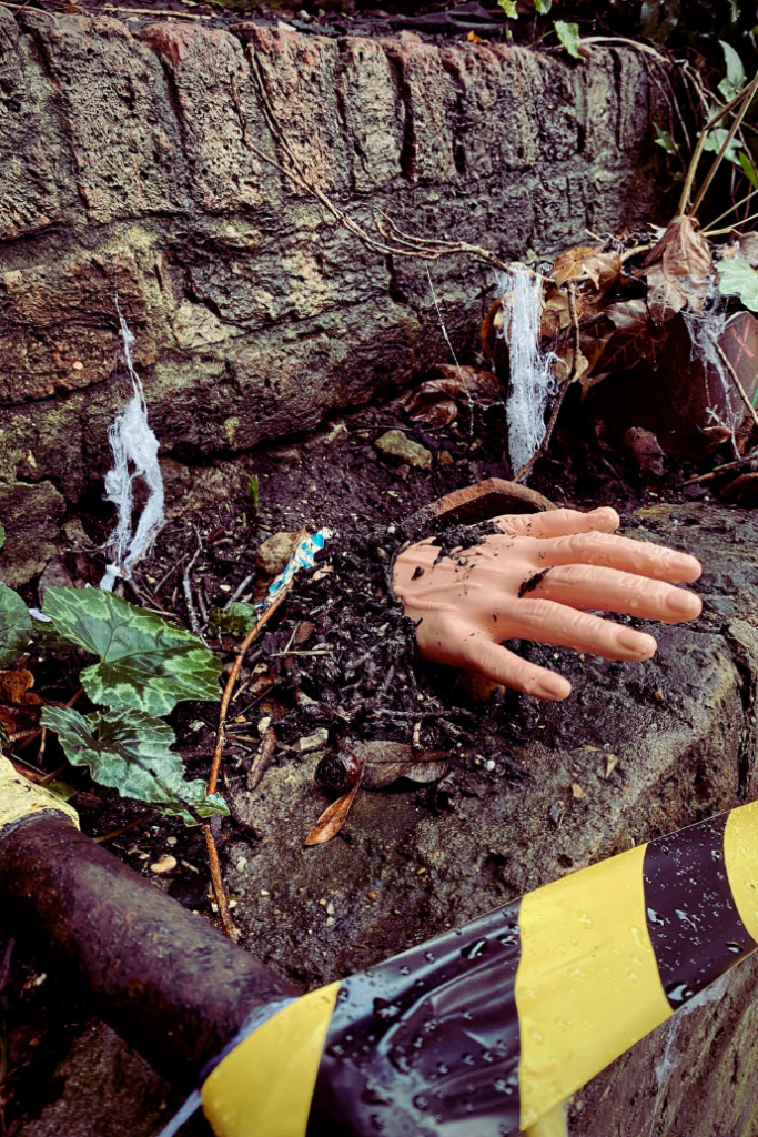 hand in dirt for halloween garden decor