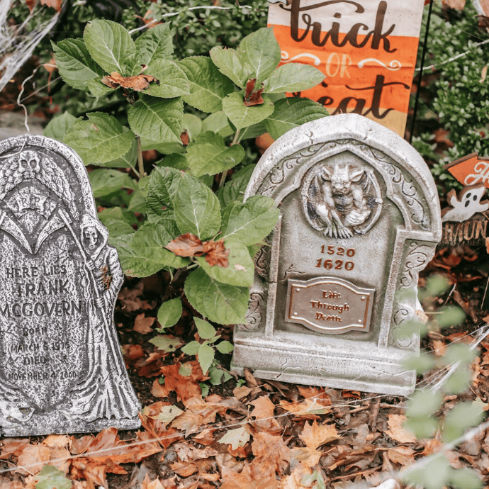 halloween tombstones, signs in garden