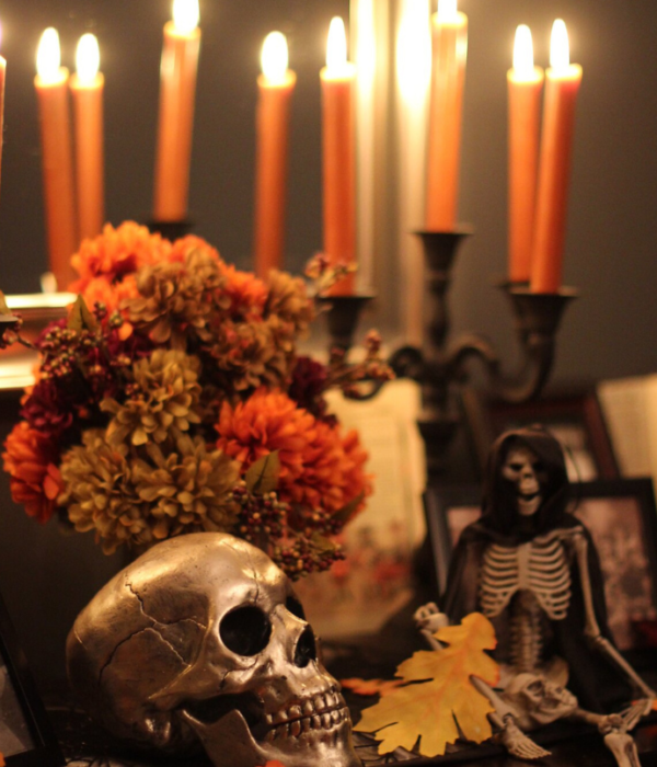 halloween candle display with taper candles, skull, flowers