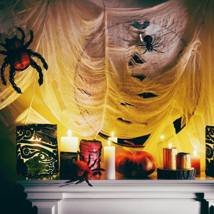 halloween candles, spiderwebs on mantel