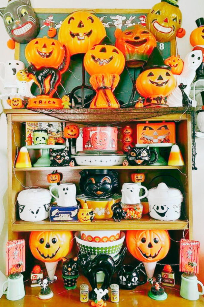 vintage halloween decorations on shelves