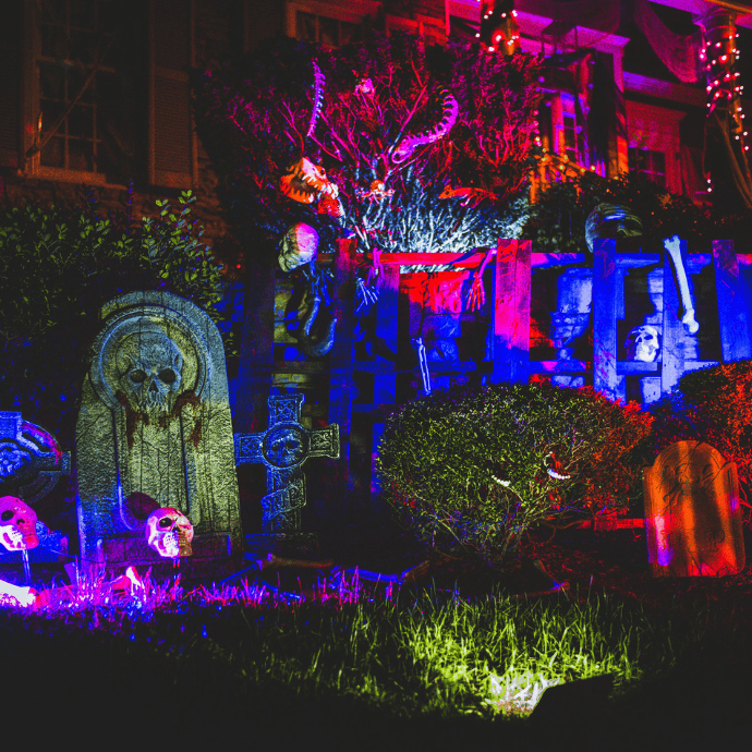 colorful lights on halloween decorations in front yard