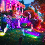 different colored up lights on halloween decorations in front yard