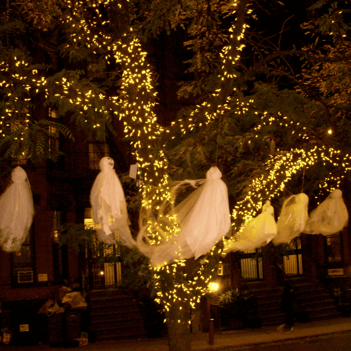 halloween string lights on tree with ghosts