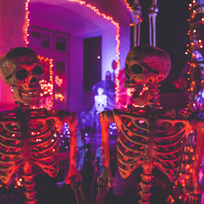 red lights on skeletons for halloween in front yard