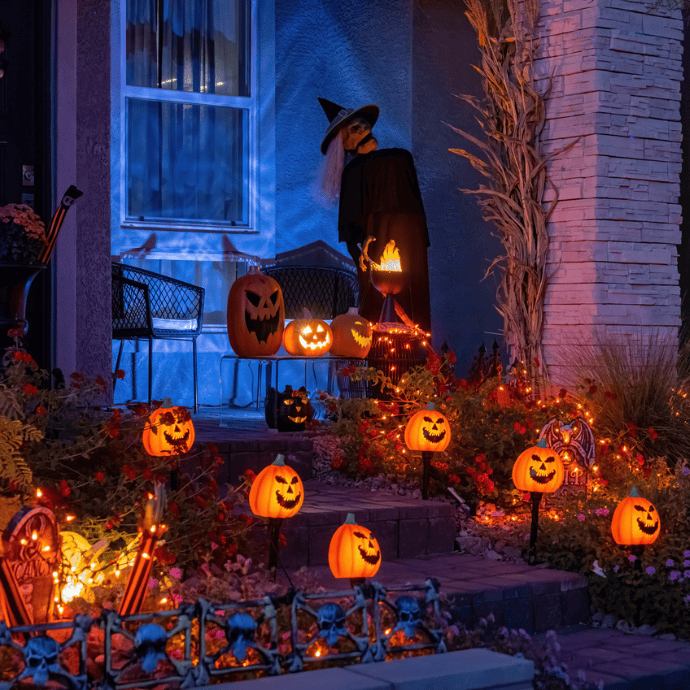 halloween front porch steps with jack-o-lantern light stakes, string lights