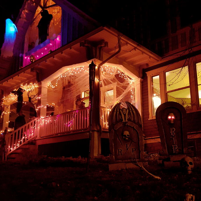 string lights on front porch decorated for halloween