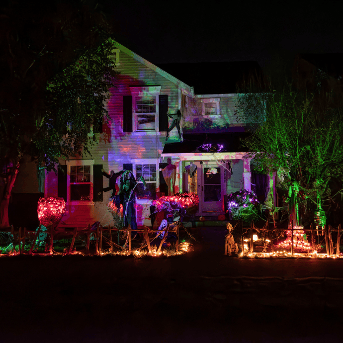 halloween front yard, house with projector lights, string lights