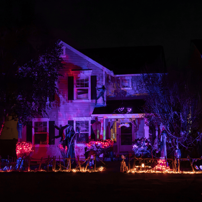 halloween projector lights on front of house