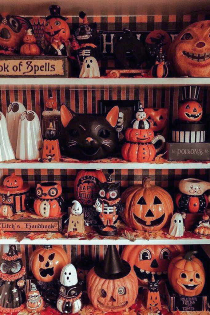 shelves with vintage halloween decorations, pumpkins, jack-o-lanterns, black cats