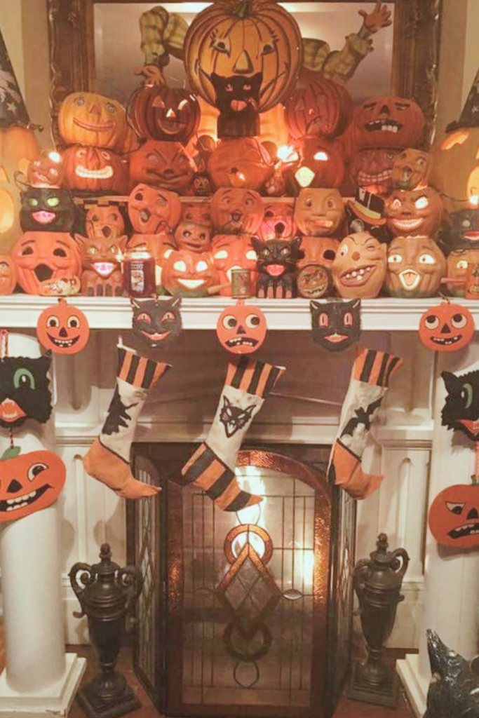 vintage halloween mantel with pumpkins, stockings