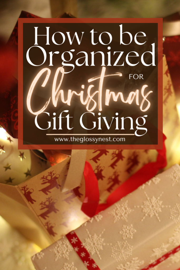 Image with a festive theme showing wrapped gifts in shiny paper and ribbon. Text overlay reads, "How to be Organized for Christmas Gift Giving" with a website URL at the bottom.