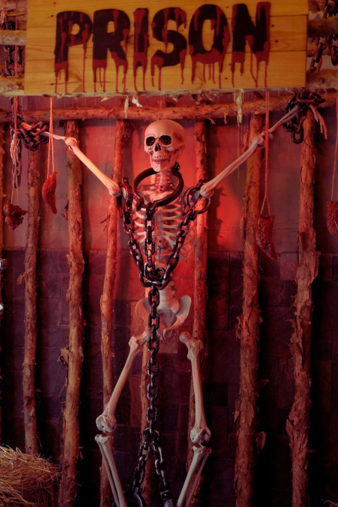 halloween decor ideas with skeleton, chains, prison