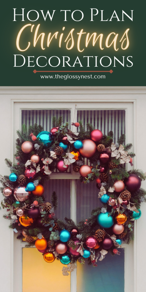 A decorative Christmas wreath made of pine branches, colorful baubles, and pinecones hangs on a door. Text above reads "How to Plan Christmas Decorations" with a website URL below: www.theglossynest.com.