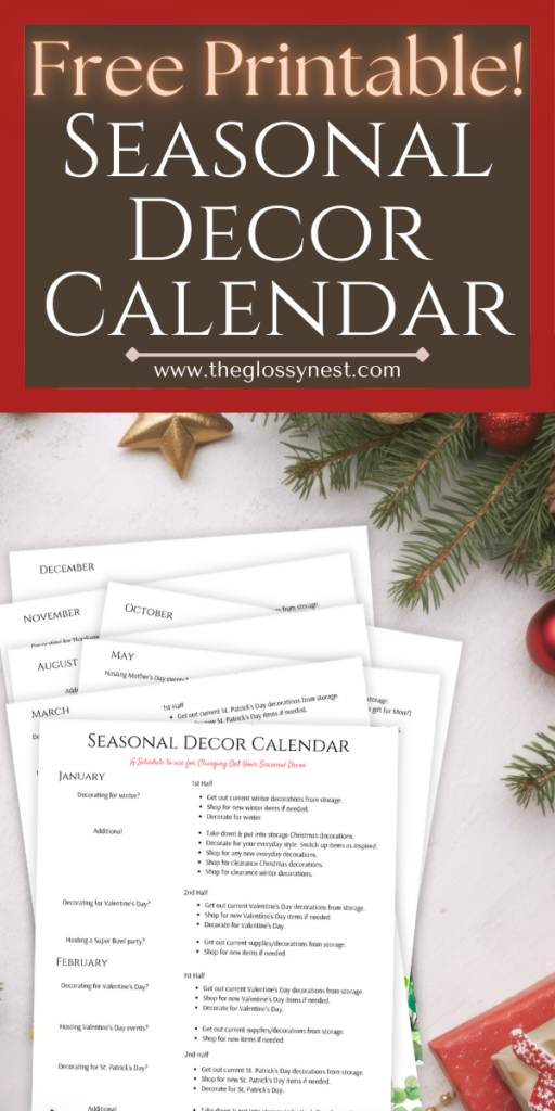 A stack of papers titled "Seasonal Decor Calendar" on a white surface. Surrounding the papers are festive decorations, including a red ornament, a pine branch, and a small gift. The website "theglossynest.com" is displayed at the top.